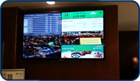 60 inch flat panel installed by Saturn Digital Media at the Holiday Inn Toronto Downtown Centre that displays current hotel events, advertising, corporate video and current flight departure information from Toronto Pearson International.