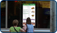 Digital Menu Screen installed at in window of Carlton Restaurant in Toronto, Ontario by Saturn Digital Media